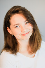 A close up of a person who is smiling and looking at the cameraundefined