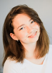 A close up of a person who is smiling and looking at the cameraundefined