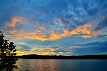 Fototapeta na wymiar Picturesque Northern sunset. Keret Lake, North Karelia, Russia