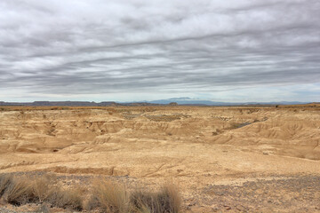 Desert landscape in a heavy cloudy day in Bardenas Reales of Navarra, Spain.