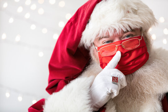 Santa Claus Places Finger Aside Of His Nose