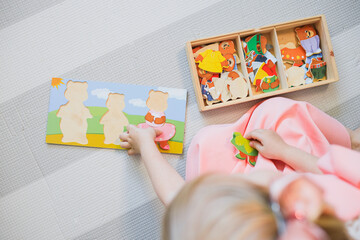 A child plays with educational games. 