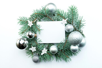 white sheet of paper with a place for text lies on top of the New Year's decor