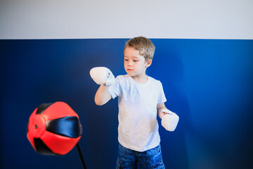 Young boy Boxing at home during self-isolation.