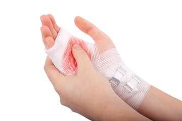 Injured hand of the girl tied up by white bandage