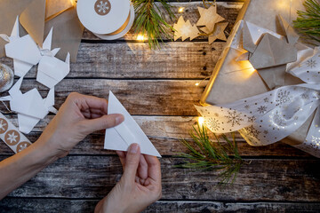 christmas decorated gift box with  origami paper bull. Symbol  2021. Instruction step by step. Flat lay, top view