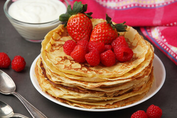 Russian cuisine national dish bliny with fresh berries