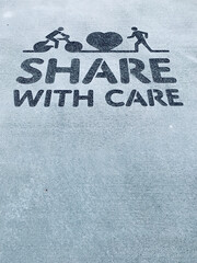 sign on the road - share with care