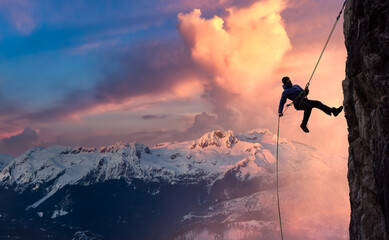 Epic Adventurous Extreme Sport Composite of Rock Climbing Man Rappelling from a Cliff. Mountain...