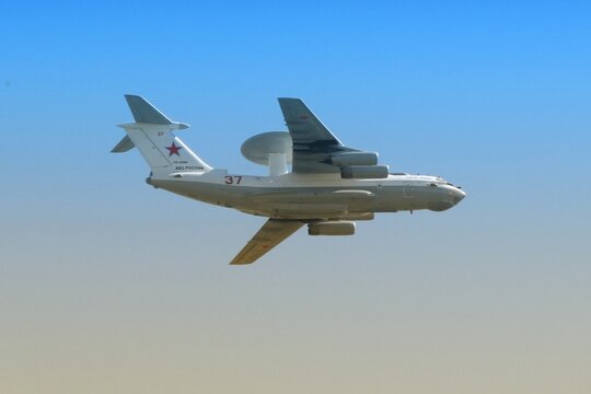 Moscow / Russia - 05 09 2014: aircraft A-50 liska flying in the blue sky, close-up