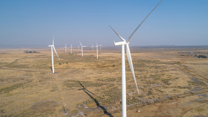 aerial image of a wind power plant in action