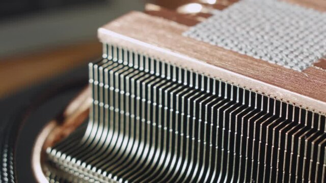 Close-up of thermal paste on the CPU cooling system. CPU cooling system thermal grease close-up macro studio shot. 