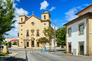 Main facade of the São Miguel church, Castelo Branco cathedral in Portugal, on a sunny spring day.