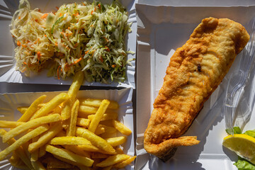 Fried fish, french fries and sauerkraut in bar in Debki resort village on the Baltic Sea coast in...