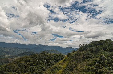 Petropolis, Brazil - December 23, 2008: Green forested mountains of Fluminence range under blue coudscape around the city.