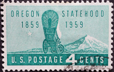 USA - Circa 1959 : a postage stamp printed in the US showing a covered wagon of the first settlers...