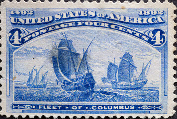 USA - Circa 1893 : a postage stamp printed in the US showing A historic sailing ship fleet...