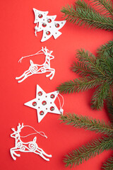 Christmas or New Year composition. Decorations on a red background. Top view.