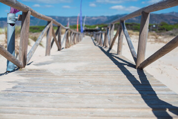 Road to the Ocean. Wooden pier at Tarifa, Cádiz, Spain.