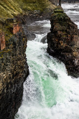 Close-up of River Waterfall with Rocky Coastline