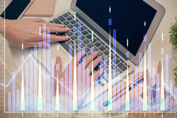 Fototapeta premium Double exposure of woman hands typing on computer and forex chart hologram drawing. Stock market analysis concept.
