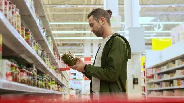 He wants to buy pickled cucumbers in the grocery