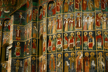 The painted medieval church in Romania. On the outer wall of Sucevita Monastery, various biblical scenes are painted