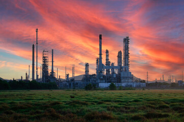 Oil refinery industry at sunset - factory - petrochemical plant