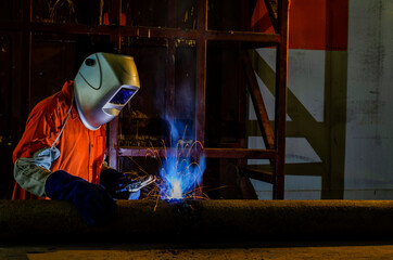 Close-up Industrial Worker at the factory welding .