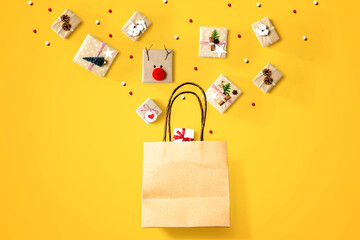 Christmas gift boxes with a shopping bag - overhead view flat lay