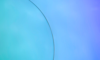 Oil bubbles on water abstract with blue background.