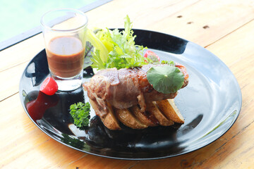 Beef Patty and suki steak in black plate.