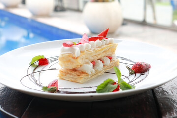 Strawberry Mille Feuille cake in white plate