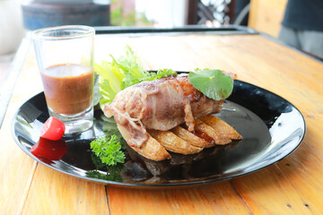 Beef Patty and suki steak in black plate.