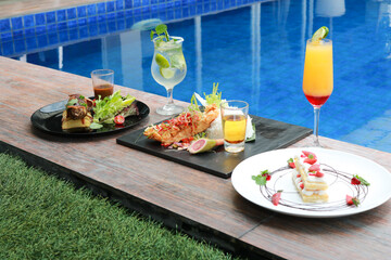 delicious food and drink with pool view