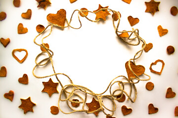 Figures from mandarin peel. Decorative frame for Christmas. Christmas background. Creative holiday ideas.