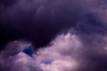 Naklejka na ściany i meble Dark storm clouds. Very cloudy and dark before a heavy shower. Thunderstorm in May.