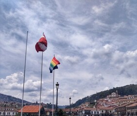Flag of Cusco and Peru - Plaza de Armas, Cusco, Peru. A city in the Peruvian Andes, was once capital of the Inca Empire, is now known for its archaeological remains and Spanish colonial architecture.