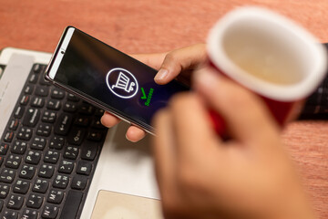 Hands holding credit card and using laptop. Online shopping