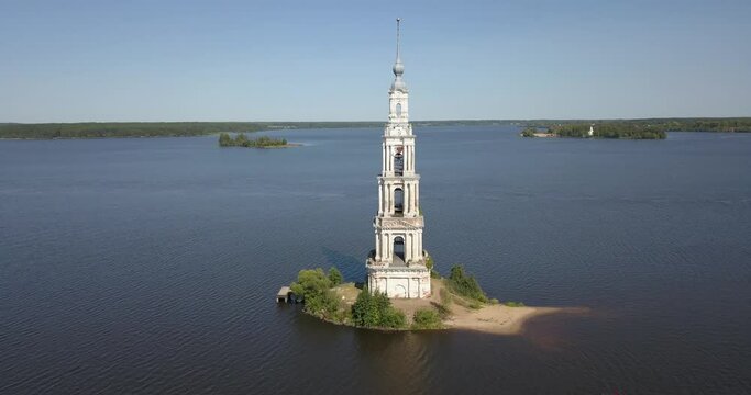 4K high quality aerial video footage of partly submerged Nikolskiy/St. Nicholas Сathedral bell tower off the shore Kalyazin town on great Volga River, Golden Ring route 200 km from Moscow, Russia