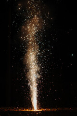 Closeup shot of the flower pot firecracker burning during the Diwali festival in India. Diwali celebration