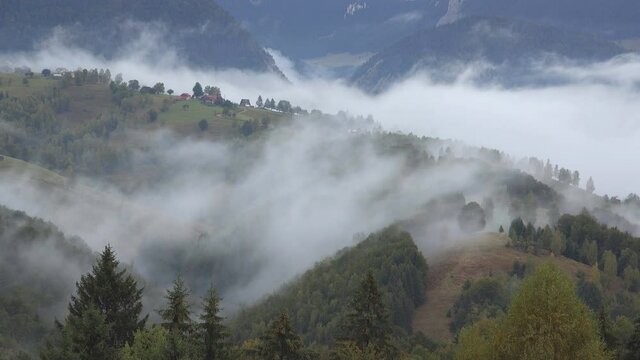 Fog passing over mountain peak, mister veil surrounded the nature, fast motion