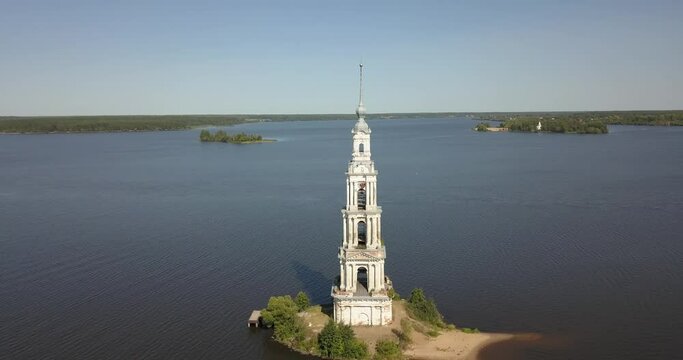 4K high quality aerial video footage of partly submerged Nikolskiy/St. Nicholas Сathedral bell tower off the shore Kalyazin town on great Volga River, Golden Ring route 200 km from Moscow, Russia