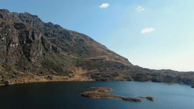 4k aerial drone footage over the 4th lagoon of Pichgacocha from Ambo, Huanuco, Peru in the Andes mountains. Dolly in and wide angle shot.