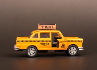 Taxi Toy with Open Doors on Black Background Travel and Discover