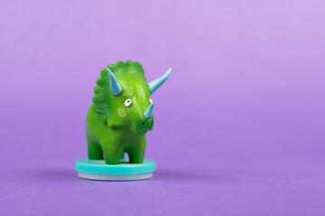 Mini Dinosaur Toy on purple background