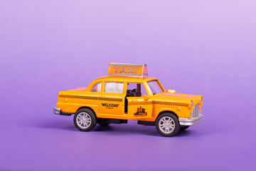 Taxi Toy with open Doors Travel Discover on Purple Background