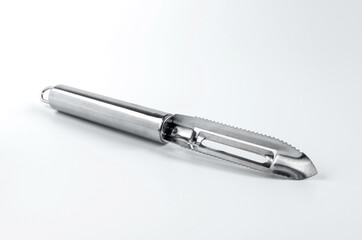 metal kitchen appliance for cleaning vegetables and fruits close-up on a white background	