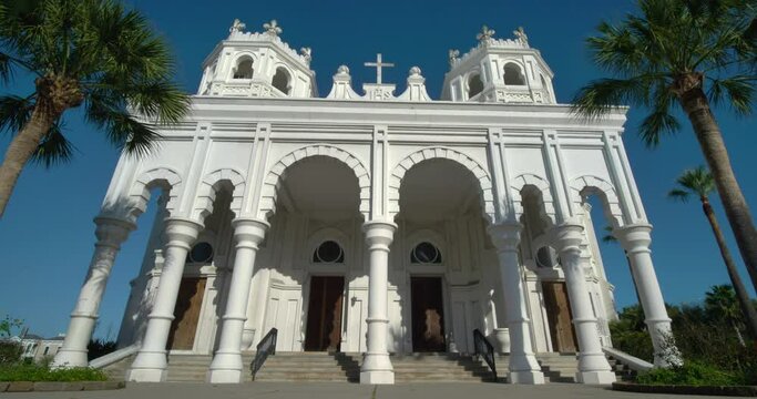 Low angle view of the Historic Sacred Heart Catholic Church on Galveston Island, Texas. This video was filmed in 4k for best image quality.