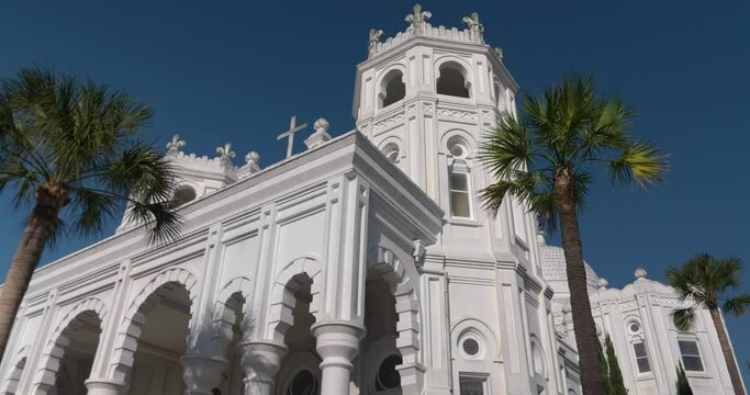 Low angle view of the Historic Sacred Heart Catholic Church on Galveston Island, Texas. This video was filmed in 4k for best image quality.